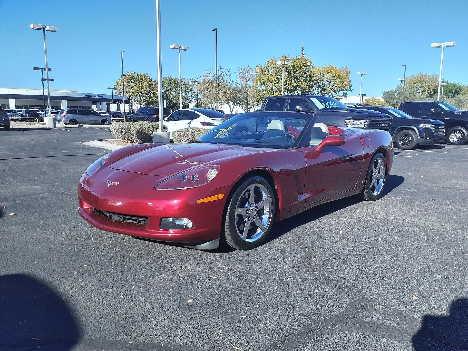 Dark red 2007 Chevrolet Corvette convertible with the top down in a parking lot